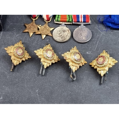 221 - A group of militaria and ephemera, to include; a framed group of five WWI British Red Cross medals, ... 