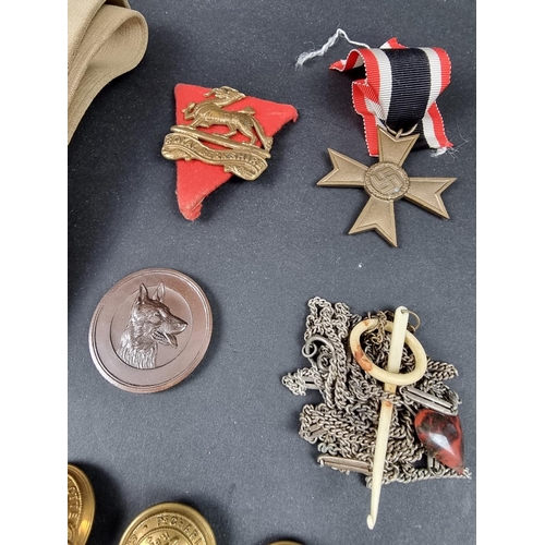 223 - Medals: a replica German War Merit Cross, second class; together with various other medals, military... 