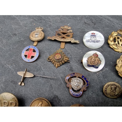 233 - A WWI Bavarian M1896 pattern brass Pickelhaube front plate; and various UK cap badges and similar. (... 