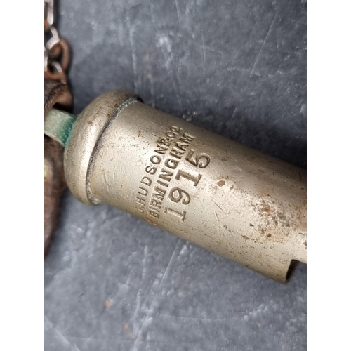 238 - A WWI British military trench whistle, by Hudson, dated 1915.