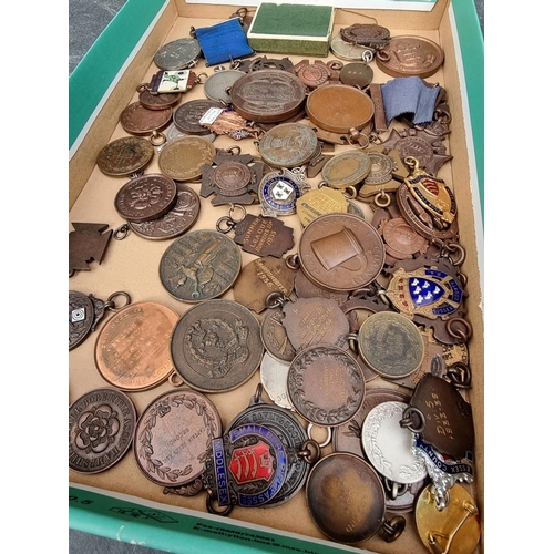 245 - A collection of 20th century Rifle shooting medals and similar; to include Bisley examples. (74)... 