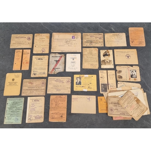 255 - A collection of German WWII identity cards, to include: Deutsche Reichsbahn and Polish worker exampl... 