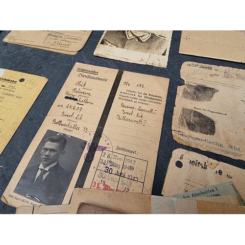 255 - A collection of German WWII identity cards, to include: Deutsche Reichsbahn and Polish worker exampl... 