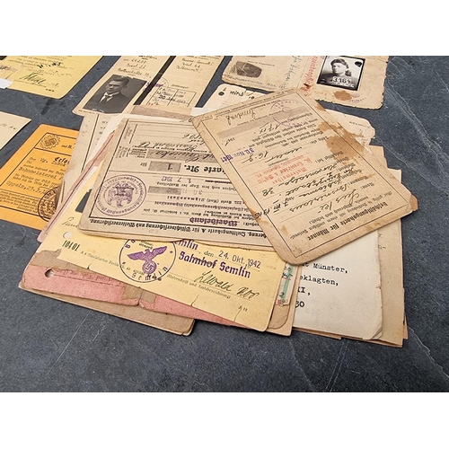 255 - A collection of German WWII identity cards, to include: Deutsche Reichsbahn and Polish worker exampl... 