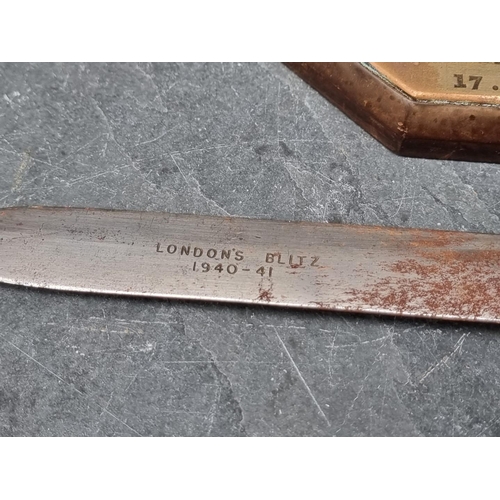 257 - A WWII shrapnel paper knife, inscribed 'London's Blitz 1940-41, 28cm; together with another piece of... 