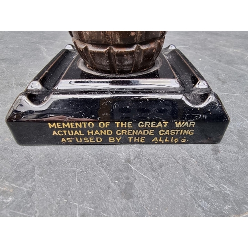 258 - A WWI novelty grenade inkwell, the pottery base inscribed 'Memento Of The Great War - Actual Hand Gr... 