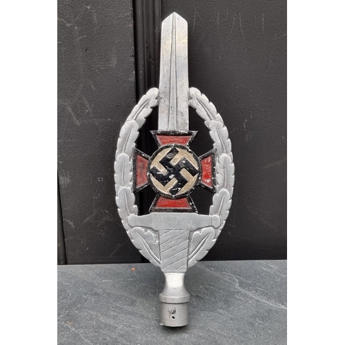 260 - A German Third Reich N.S.D.A.P painted aluminium flag finial, 33cm high.