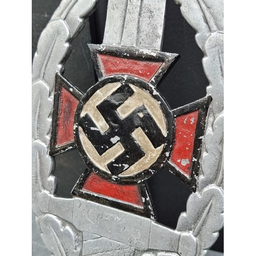 260 - A German Third Reich N.S.D.A.P painted aluminium flag finial, 33cm high.