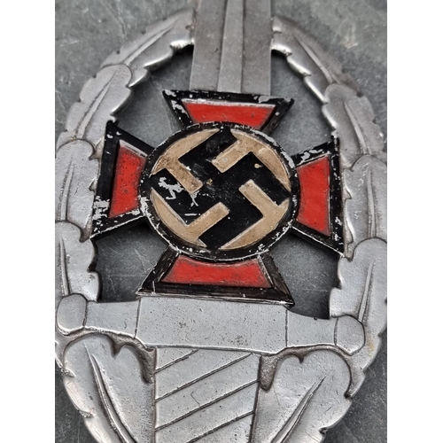 260 - A German Third Reich N.S.D.A.P painted aluminium flag finial, 33cm high.