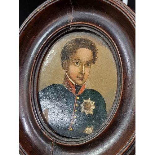 261 - A 19th century Russian portrait miniature of a young man in uniform, wearing The Order of The Noble ... 