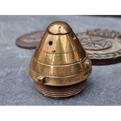 268 - A WWI shrapnel shell fuse, dated 1915 converted to inkwell; together with a bronze Maltese plaque; a... 