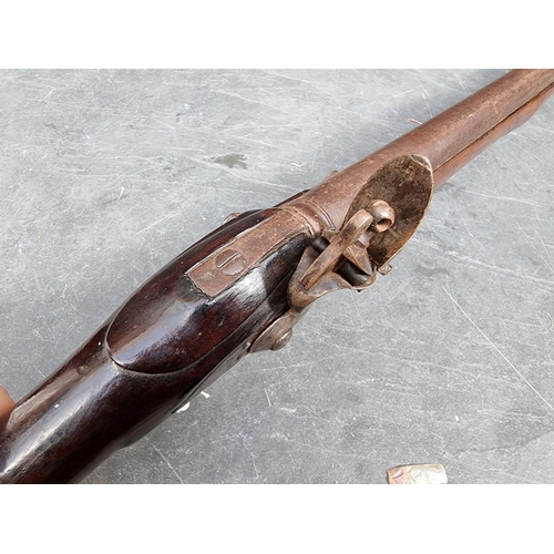 27 - A 'Brown Bess' musket, with 38in smooth barrel with tower lock, (missing sling mounts), brass butt p... 