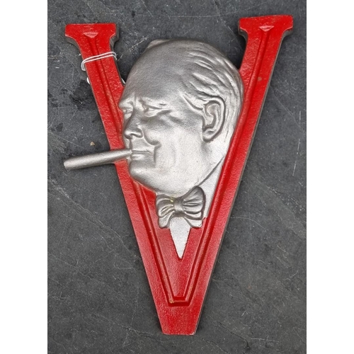 283 - A post-war painted aluminium Winston Churchill V for Victory sign, 29.5cm high.