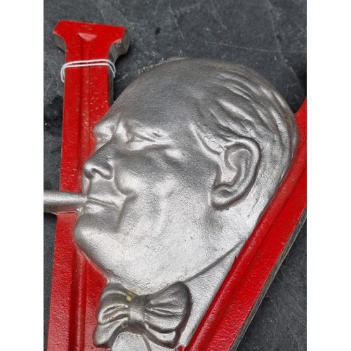 283 - A post-war painted aluminium Winston Churchill V for Victory sign, 29.5cm high.