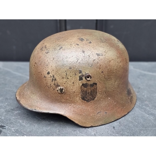 288 - A German WWII M40 NS66 splotch camouflaged steel helmet, by Vereinigte Deutsche Nickelwerke, Schwert... 