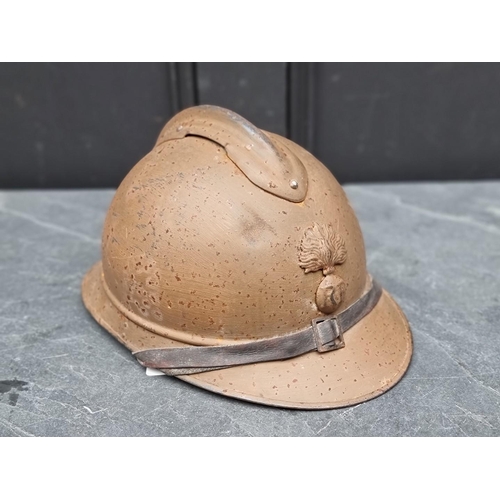 289 - A WWI French colonial Adrian helmet, mustard colour.