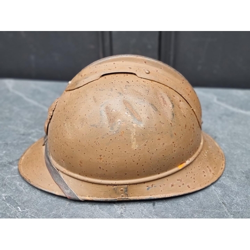 289 - A WWI French colonial Adrian helmet, mustard colour.