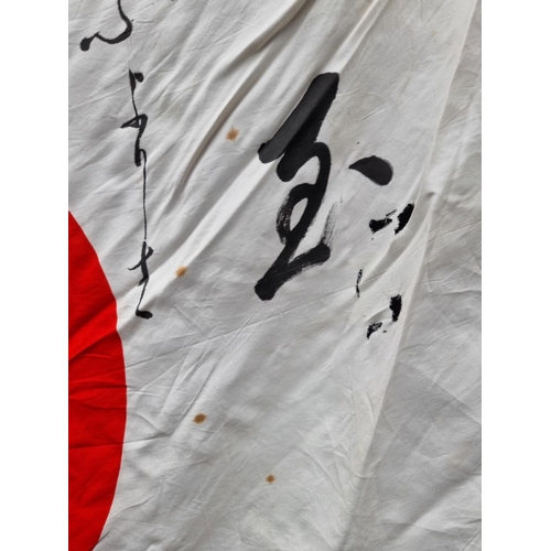 293 - A Japanese silk battle flag, approximately 95 x 66cm.