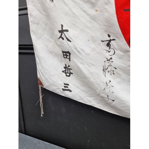 293 - A Japanese silk battle flag, approximately 95 x 66cm.