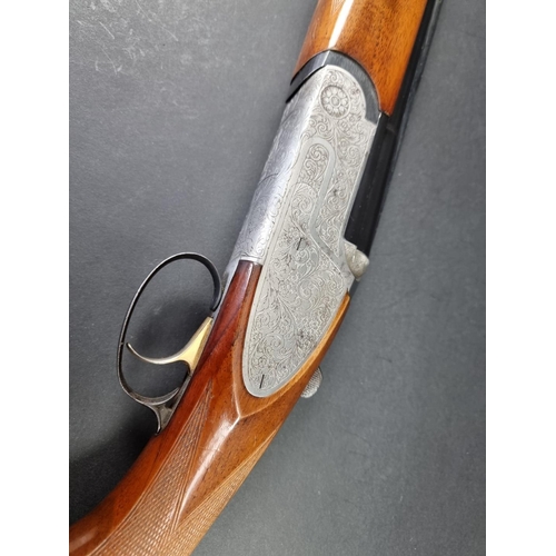 30 - An Emilio Rizzini double barrel over and under 12 bore shotgun, made in Italy, Serial No.27455.(PLEA... 