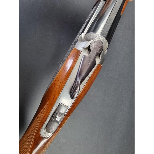 30 - An Emilio Rizzini double barrel over and under 12 bore shotgun, made in Italy, Serial No.27455.(PLEA... 