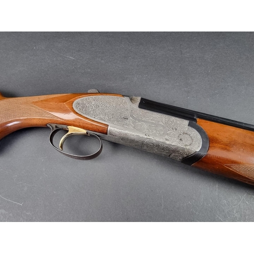 30 - An Emilio Rizzini double barrel over and under 12 bore shotgun, made in Italy, Serial No.27455.(PLEA... 