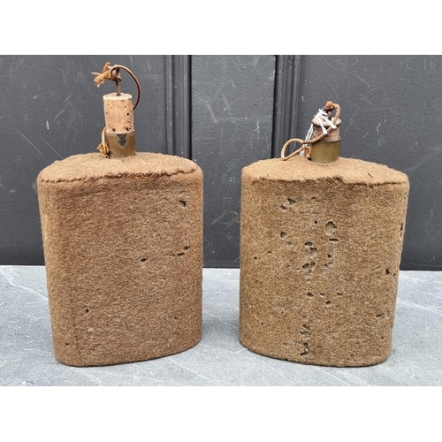 303 - Two WWII British army water canteens, both covered in khaki fabric, 21cm high including spout.... 