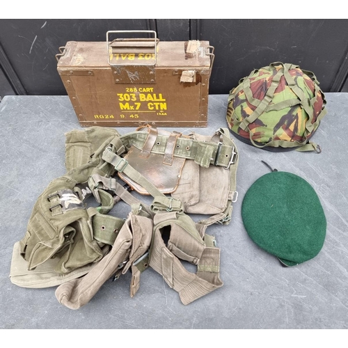 313 - A British army combat helmet GS MK6, dated 1984, size large; together with a German army green beret... 