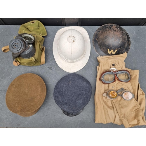 318 - A group of militaria; comprising a British gas mask, dated 1943; an RAF officer's peaked cap; an ARP... 