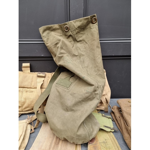 323 - A kit bag of mixed British military webbing.