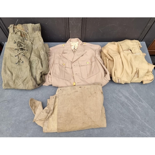 327 - A carton of mixed military clothing, to include a WWII US Navy deck jacket, (a.f.); coveralls e... 