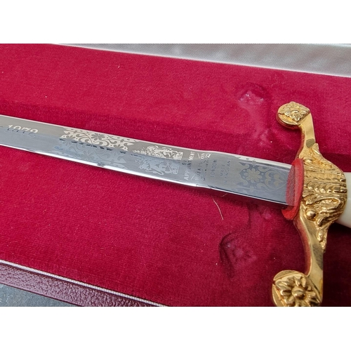 54 - A cased Wilkinson Sword 1972 bicentennial presentation dagger and sheath, the 27.5cm blade etched, t... 