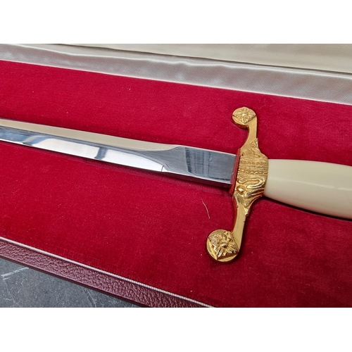 54 - A cased Wilkinson Sword 1972 bicentennial presentation dagger and sheath, the 27.5cm blade etched, t... 