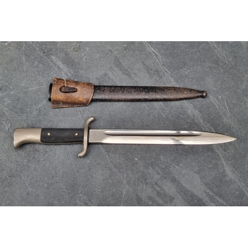 63 - A German K98 dress bayonet and scabbard, having 25cm blade.