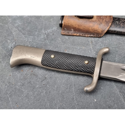 63 - A German K98 dress bayonet and scabbard, having 25cm blade.