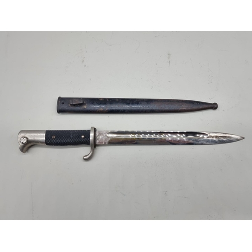 68 - A German WWII parade bayonet and scabbard, by E F Horster Solingen, with 24.5cm blade.... 