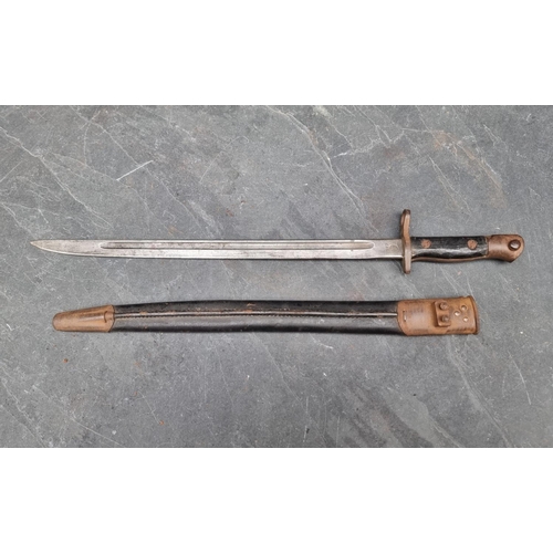 73 - A WWI British 1913 pattern bayonet and scabbard, with 43cm blade stamped 'Remington 1917'.... 