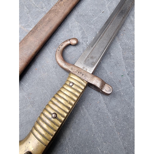 80 - A French M1866 pattern chassepot sword bayonet and scabbard, the 57cm blade engraved 'St Etienne 186... 