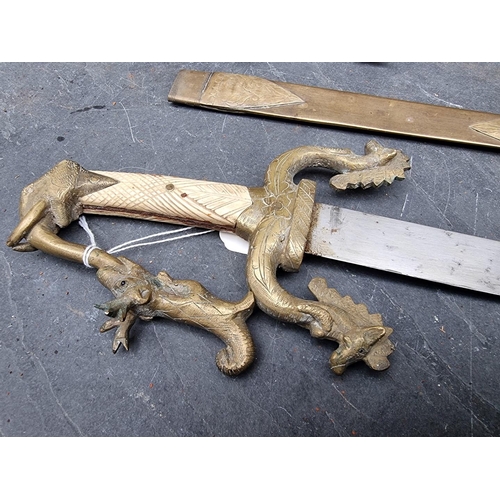 83 - Two Eastern daggers and sheaths, possibly Indian, with 34.5cm and 35.5cm blades respectively, each w... 