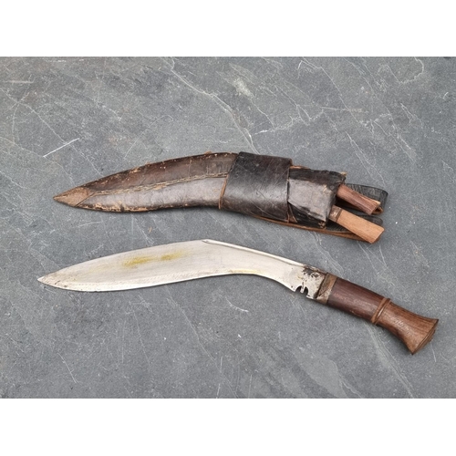 84 - Two Nepalese Gurkha kukris and sheaths, each blade approximately 33cm long, with frogs.... 