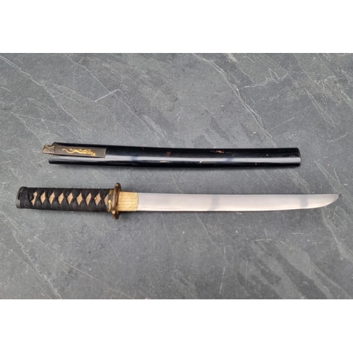 91 - A Japanese sword and scabbard, having 55cm blade.