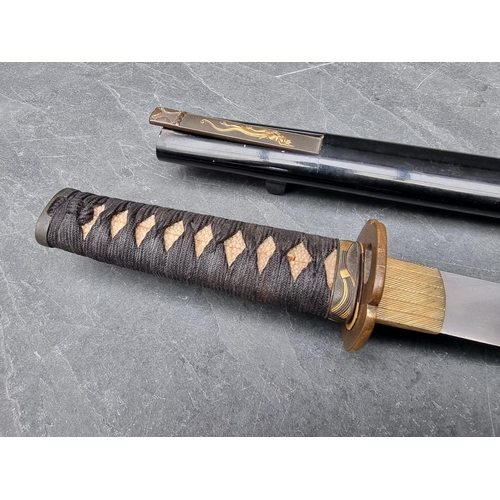 91 - A Japanese sword and scabbard, having 55cm blade.