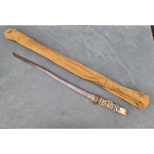 92 - A Japanese katana, having 66.5cm blade, in canvas carrying case.