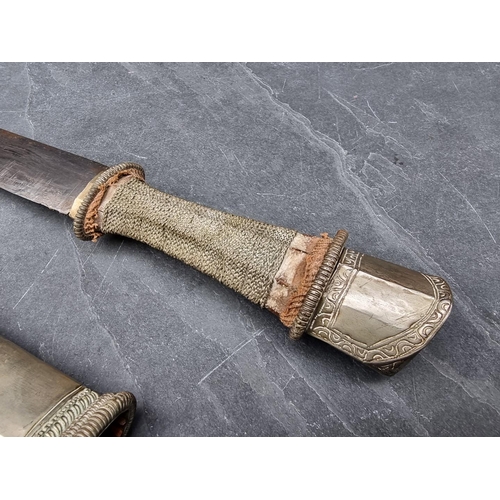 96 - A Tibetan dpa'dam long sword and scabbard, with traditionally made 68cm blade, wire grip and plated ... 