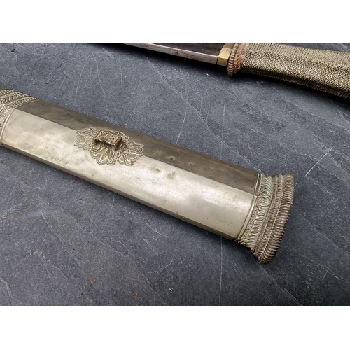 96 - A Tibetan dpa'dam long sword and scabbard, with traditionally made 68cm blade, wire grip and plated ... 