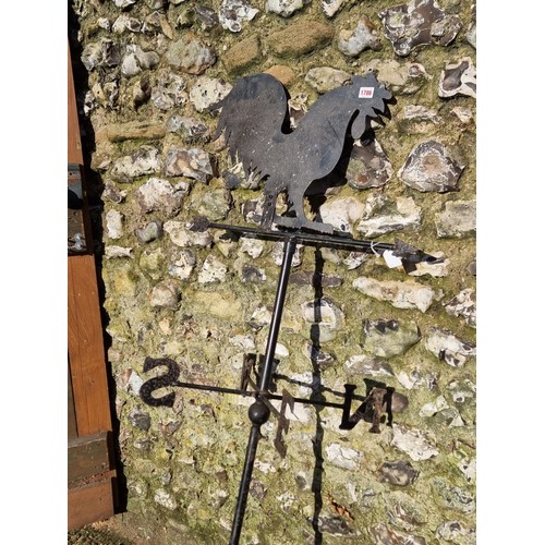 1786 - An old black painted metal weather vane, 173cm high.