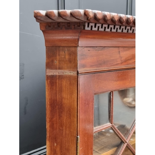 1016 - An old mahogany standing corner cupboard, 98cm wide.