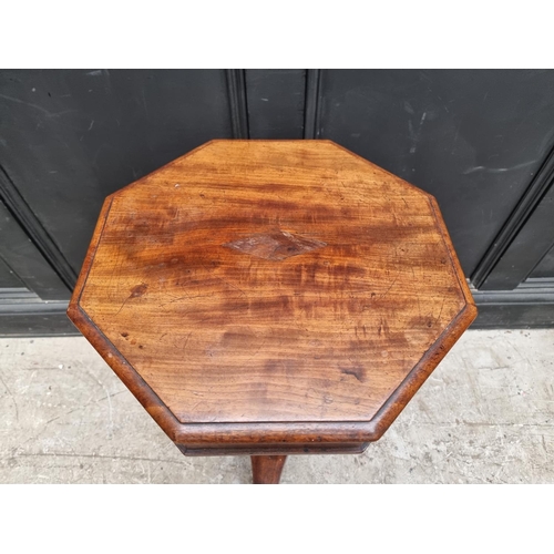 1053 - A Victorian mahogany octagonal trumpet work table, 42cm wide.