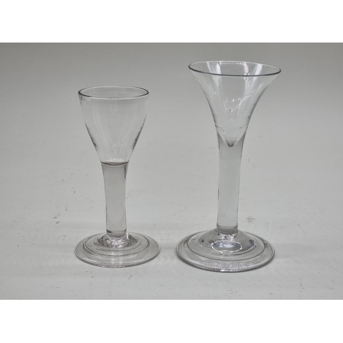 1245 - Two 18th century plain stemmed glasses, 12cm and 14cm high. (2)