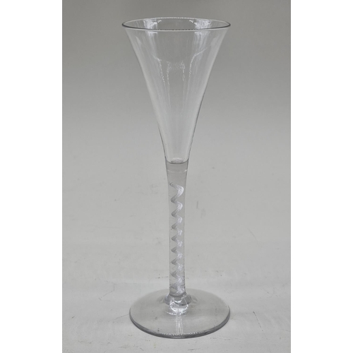 1250 - An 18th century air twist glass flute, 19cm high.